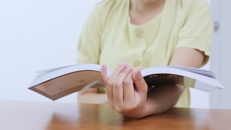 a person enjoys reading a book at home highlighting a moment of relaxation and leisure