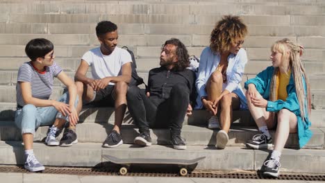 stylish young friends chatting on street