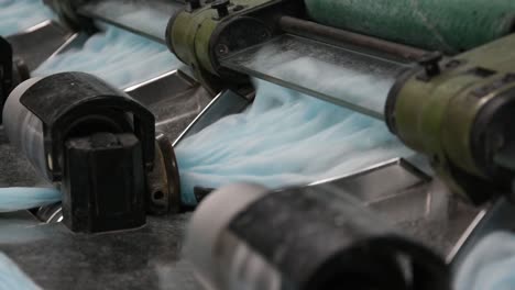 Industrial-knitting-machine-producing-cotton-yarn