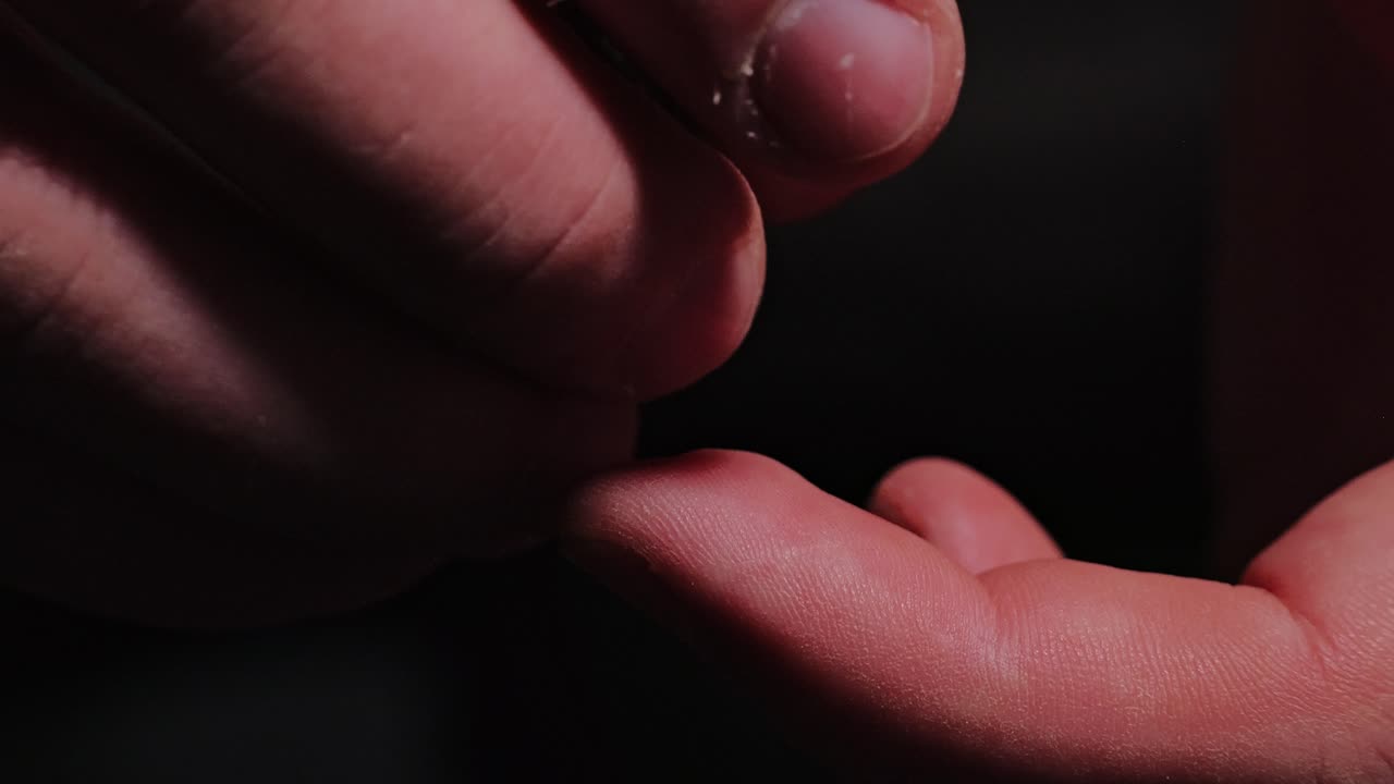 Bullet in man’s hand symbolizes armed conflict war risk and fragile security