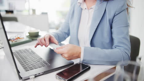 woman using laptop and credit card for online shopping