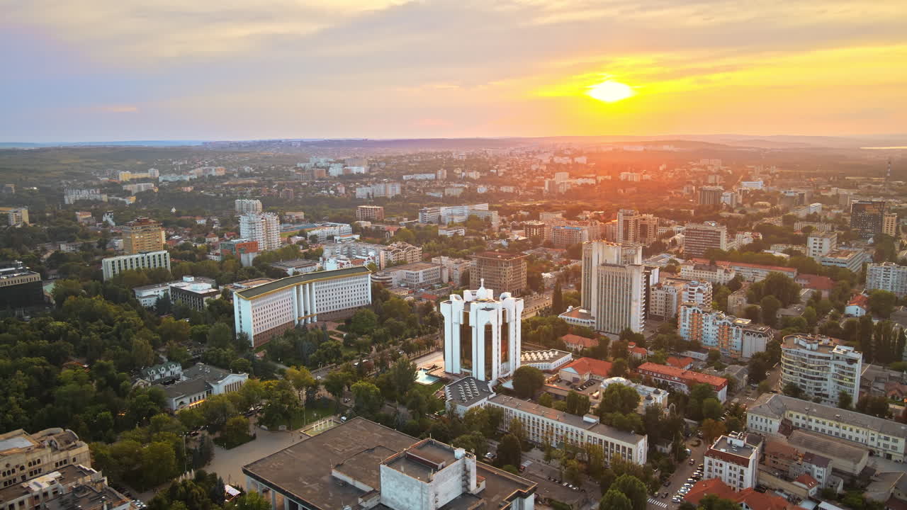 Aerial sunset drone view of Chisinau city center with presidency and parliament building. Moldova