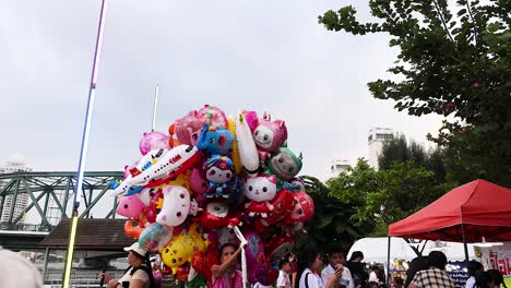 vibrant balloons attract crowds in bangkok market