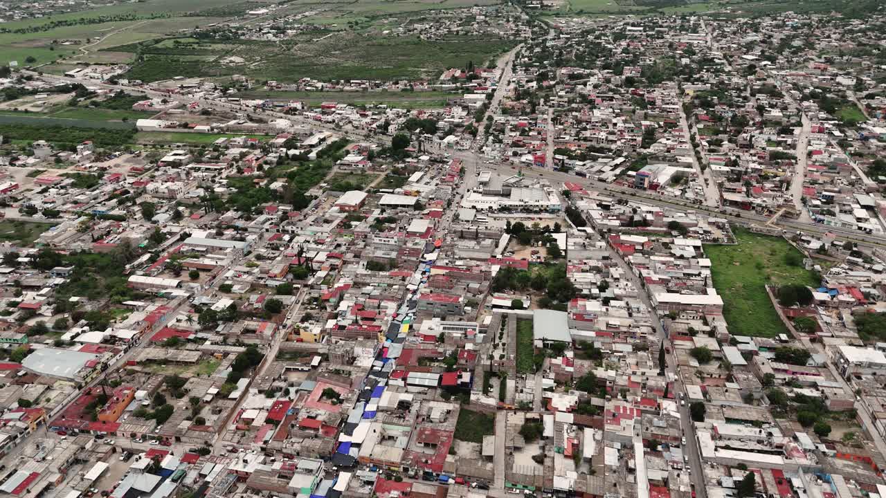 Aerial view of a sprawling urban landscape with dense residential areas
