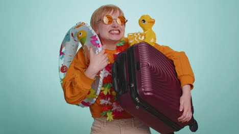 traveler tourist young woman girl celebrating dancing fooling with swimming inflatable duck toy