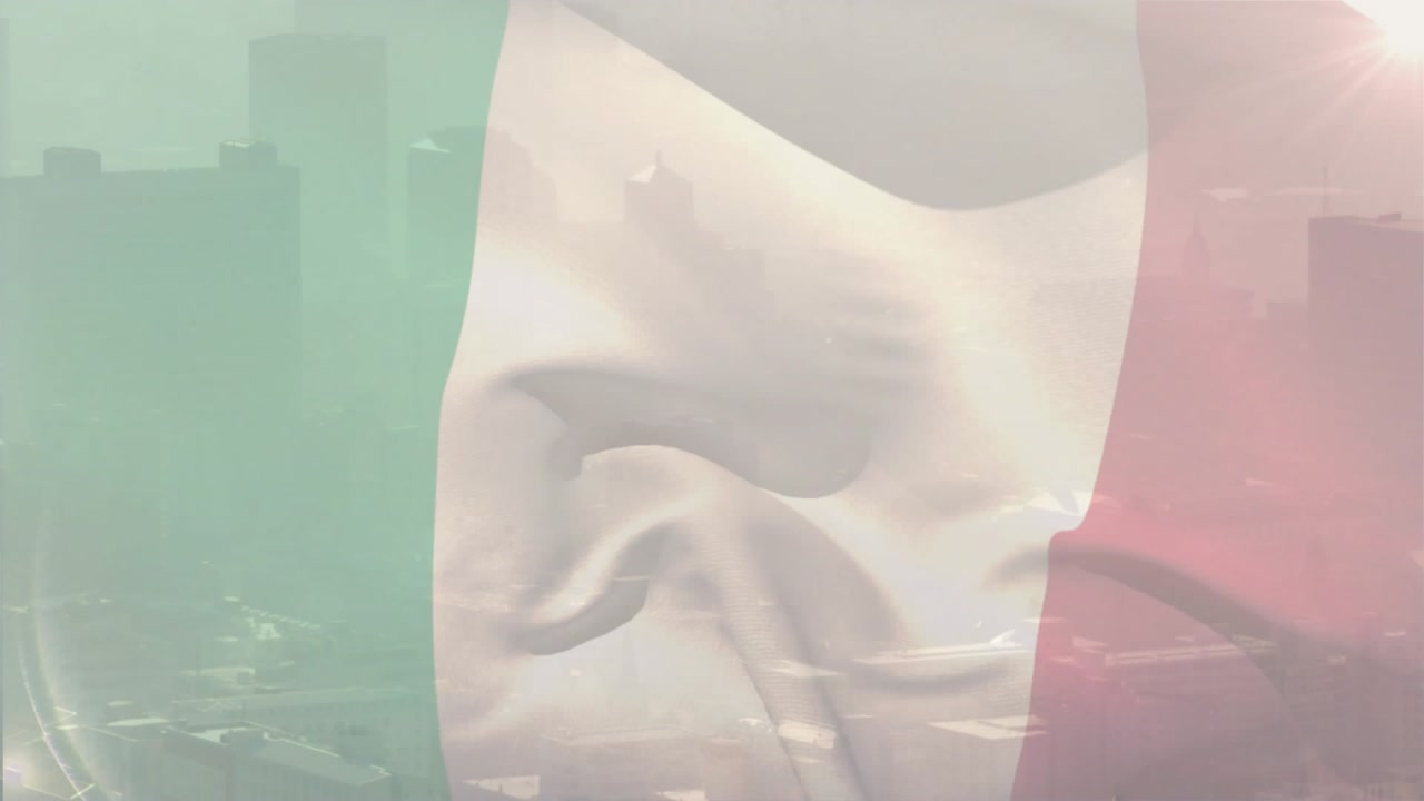 Breeze lifting flag fabric, waving over skyline, sun flare altering translucency for marketing