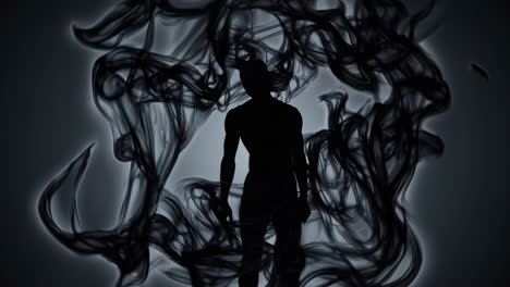 silhouette of a man in a dark smoky atmosphere