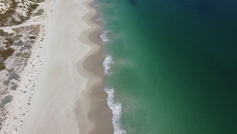 Aerial-Reveal-Shot-Of-Turquoise-Waters-Of-Mindarie-Beach-Perth