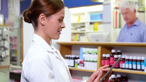 pharmacist using digital tablet