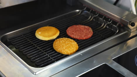 cooking beef and pork patty for burger. meat roasted at kitchen. slow motion.