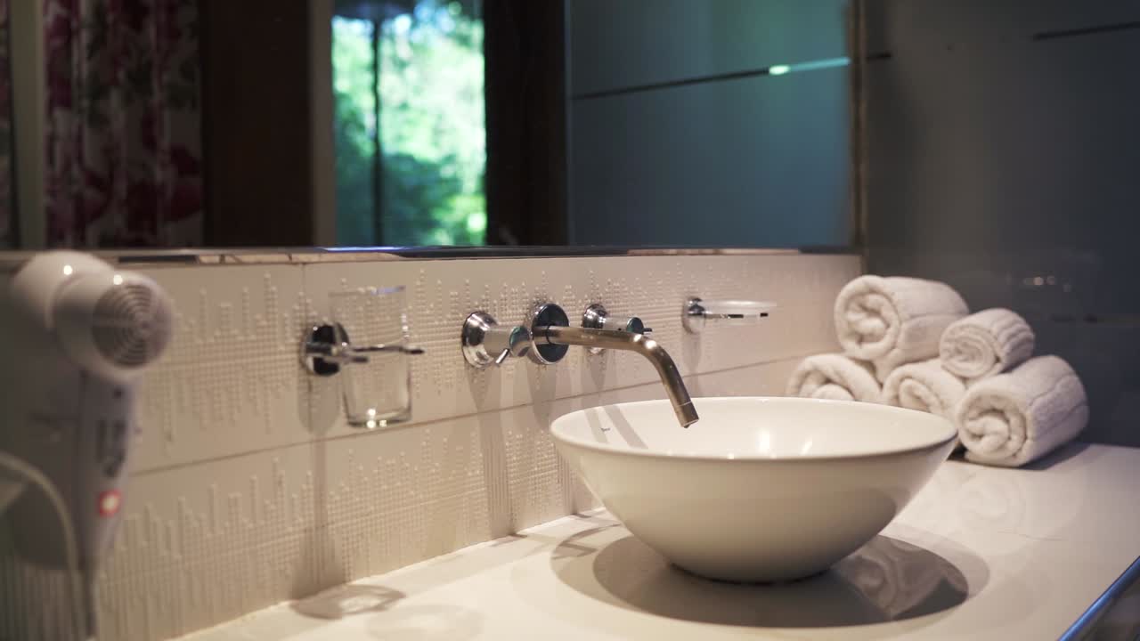 Modern Bathroom Interior with White Sink and Towels