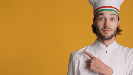 caucasian man in front of camera on yellow background.