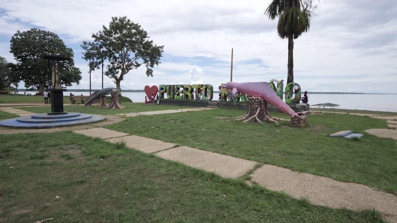 Teenagers playing around the port of Narino, Colombia. The green Amazon river area.