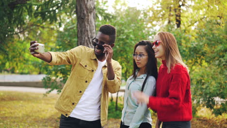 friends taking a selfie in an autumn park