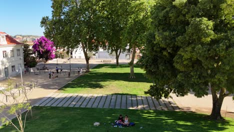 panoramic view of lisbon cityscape, tagus river, and urban park