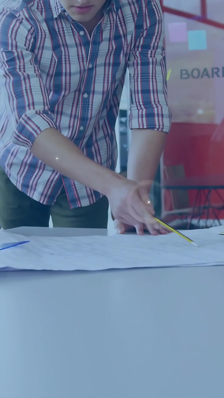 Vertical video: Man placing hands on plan marking with pencil, causing nodes over hands for design