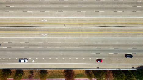 an aerial view of light flowing traffic, on a highway, at 60 frames