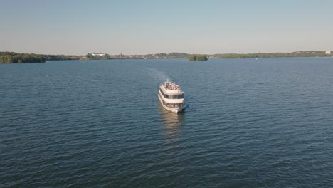 boat sailing on water on sunny day with small waves