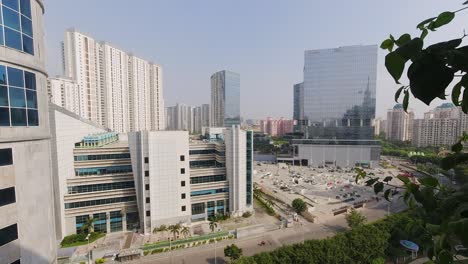 Time-Lapse-Overlooking-City-View-with-Buildings-and-Road-Outside-Gurugram-in-India-with-Clear-Blue-Skies