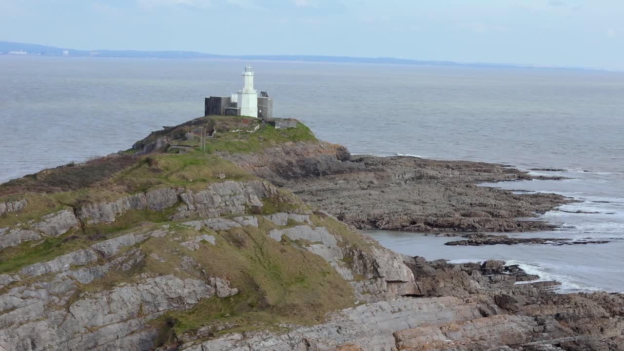 Panning shot of Mumbles Lighthouse near Swansea in United Kingdom