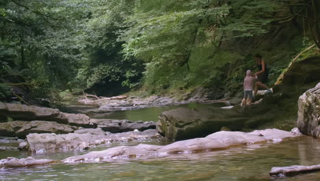 mother and child on a scenic river hike