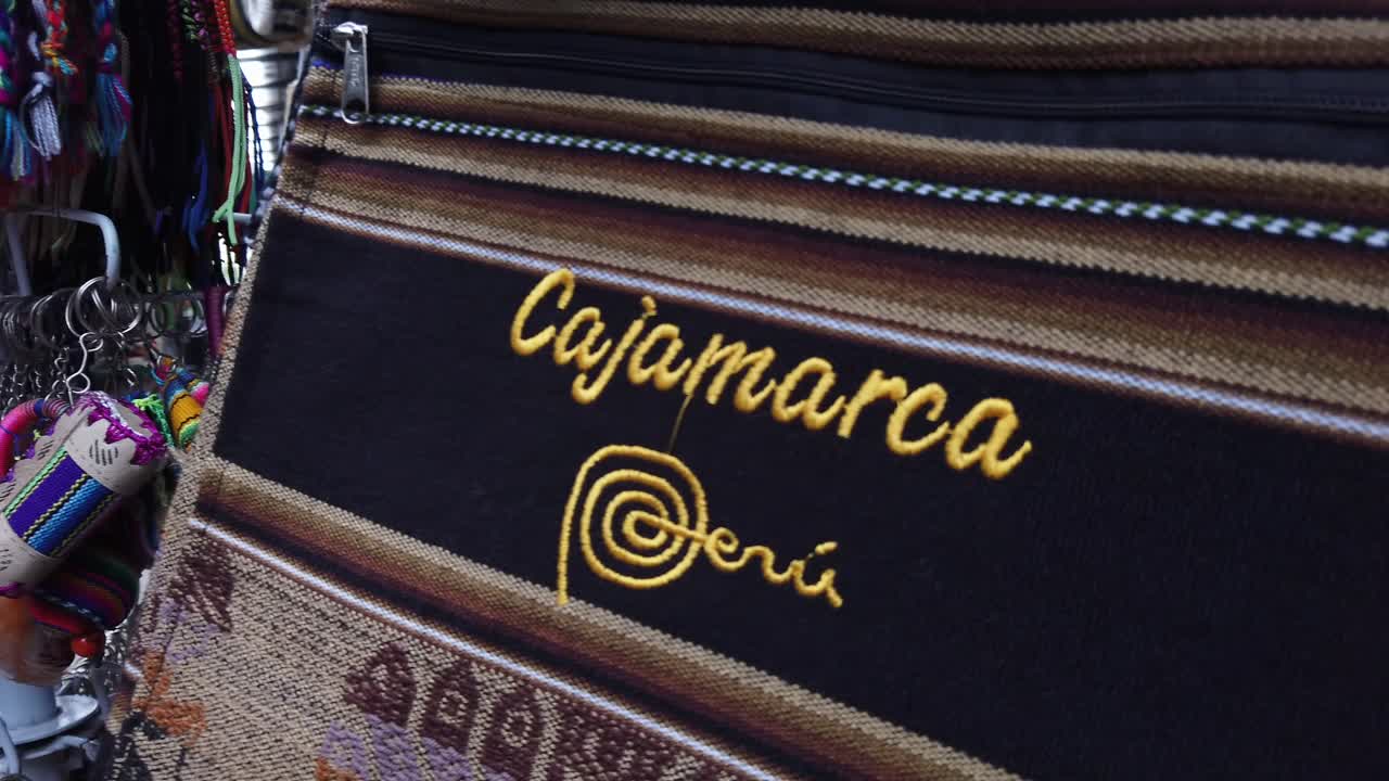 Colorful Handicrafts And Souvenir Items For Sale In A Market Stall At Cajamarca, Peru. - Slow Motion, Dolly Out