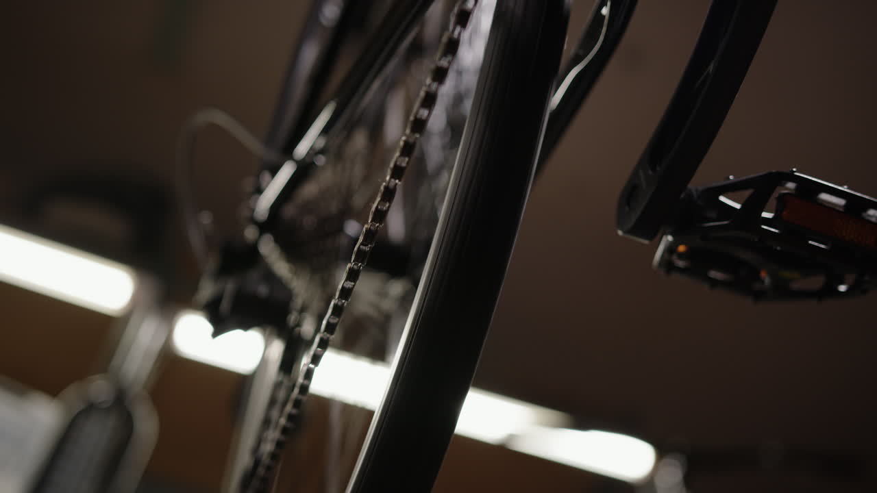 Close-Up of Spinning Bicycle Pedal and Wheel in Motion – Cycling Mechanics Detail