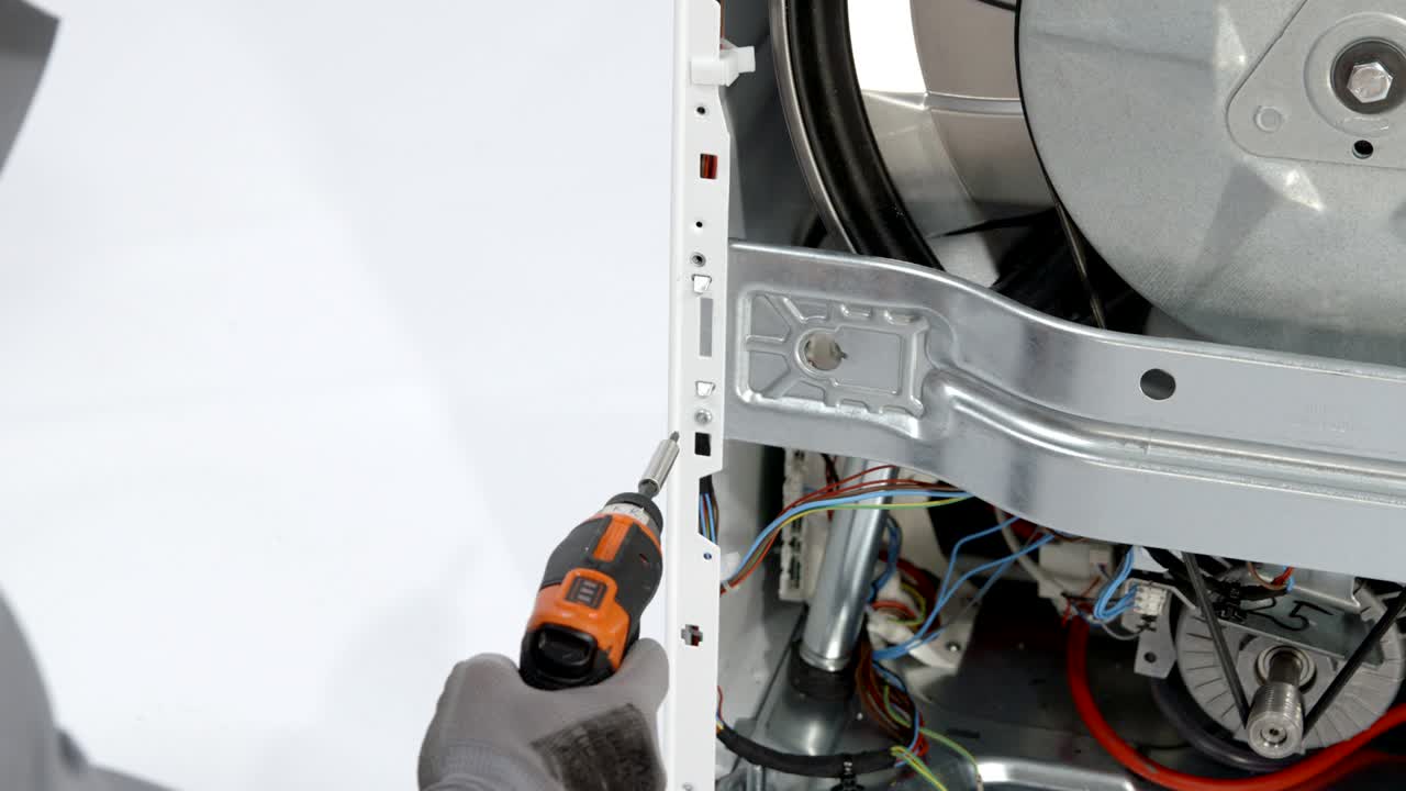 Unscrewing screw at the back side of the washer with caution