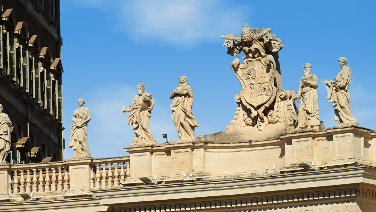 Statues on the Facade of St. Peter's Basilica on the blue sky background, in St. Peter's Square, Vatican City, Rome, Italy