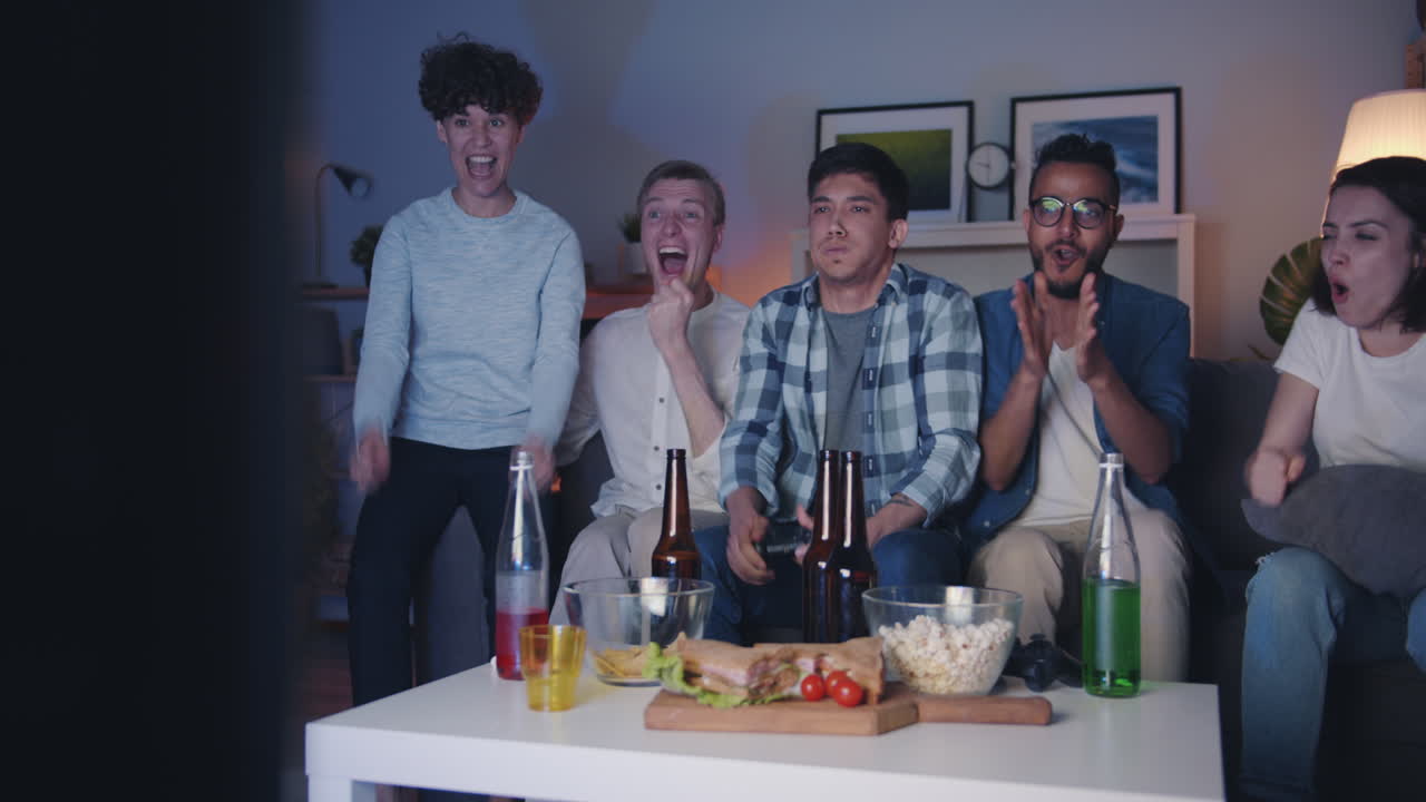 Friends Watching TV and Gaming at Home