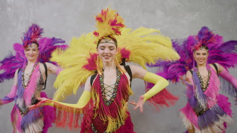 three beautiful cabaret girls dancing