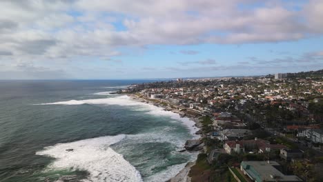 waves crashing on rugged shore of bird rock neighborhood in san diego, california usa