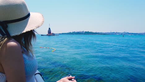 slow motion:beautiful girl takes pictures of bosphorus,a popular destination in uskudar town,istanbul,turkey