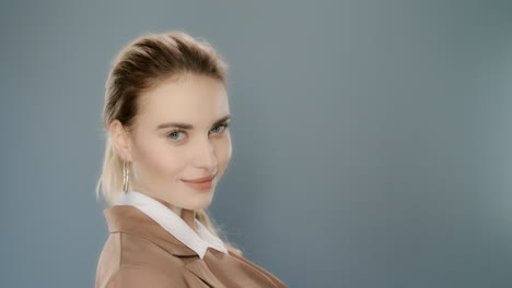 Young-business-woman-smiling-in-studio