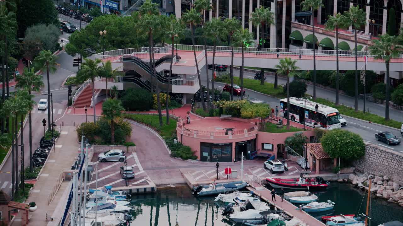 La Condamine, Monaco - October 4, 2024: View of boats docked in the Monaco Marina with the skyline of the city on the background