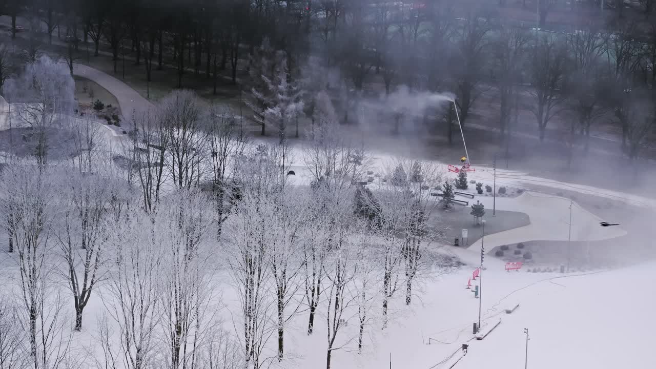Aerial of snowy scene in Victory Park Riga, machine-generated snow everywhere