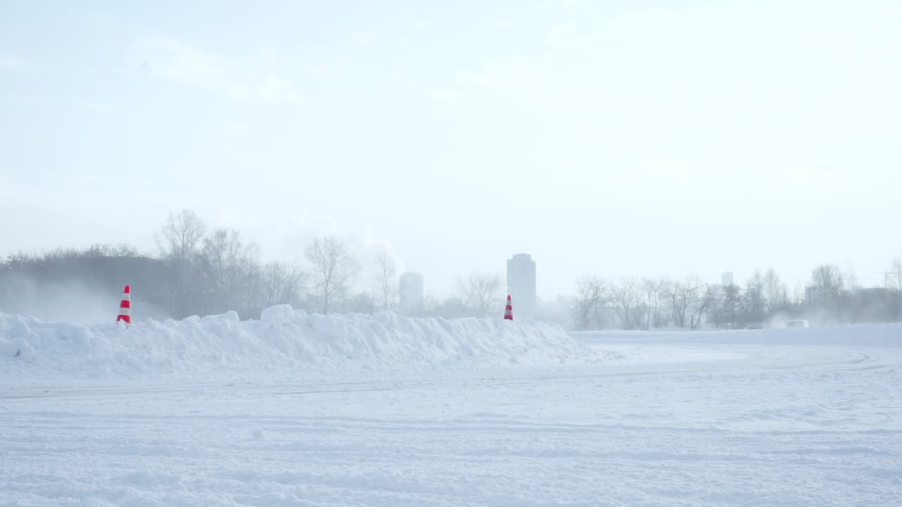Snowy Track with Fog and Cones