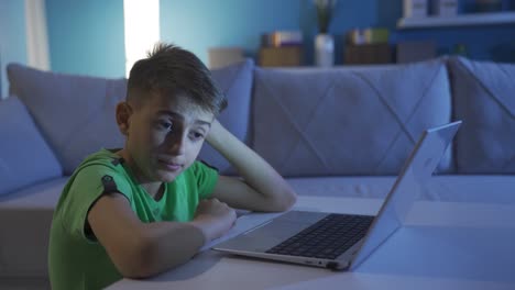 Stressed-and-thoughtful-boy-looking-at-computer.