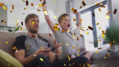 animation of gold confetti falling over caucasian man with son cheering playing video games