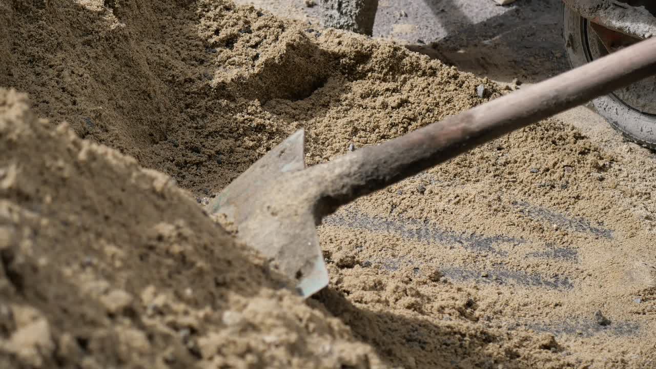 Construction Site with Sand and Wheelbarrow