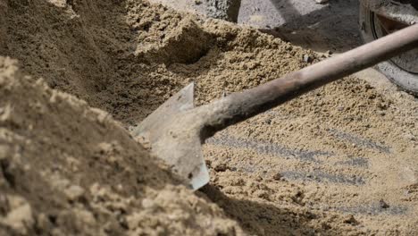 construction site with sand and wheelbarrow