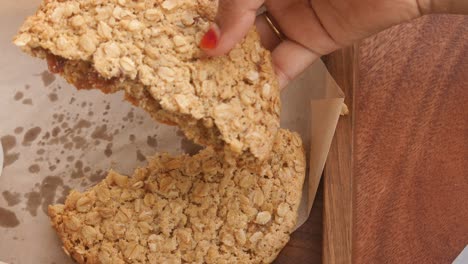 a close up shot of a broken oatmeal cookie