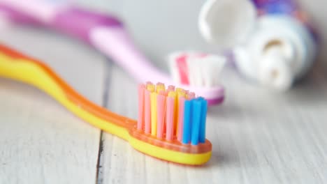 colorful children's toothbrushes and toothpaste