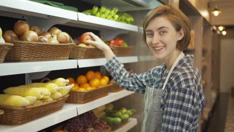 woman shopping for produce at a grocery store