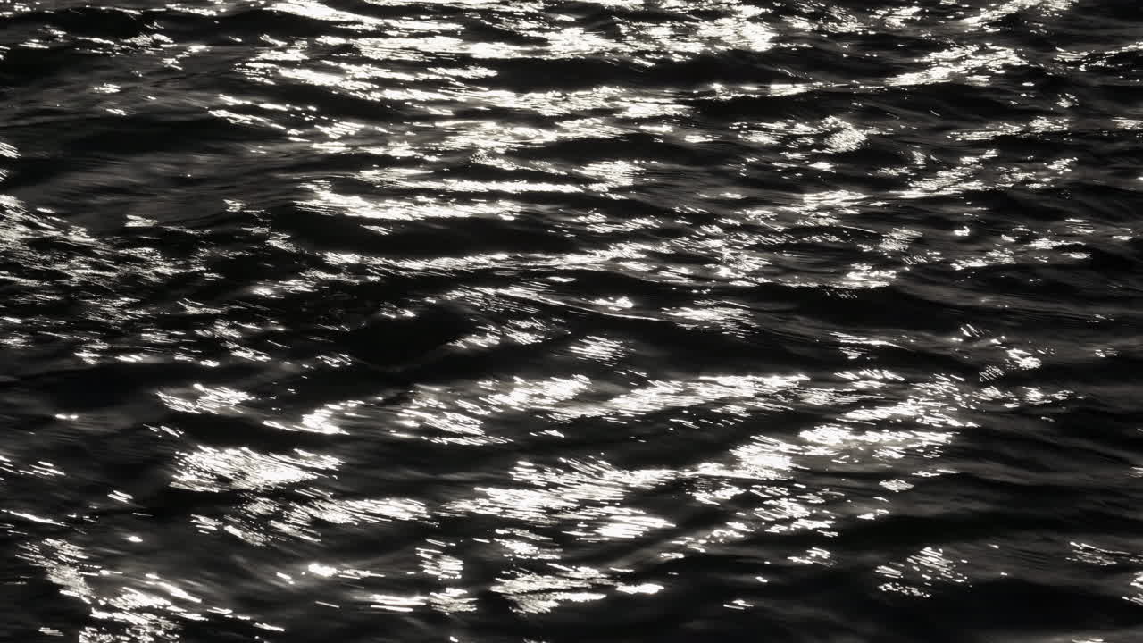 A closeup of fast flowing water in the River Arrow, Warwickshire, UK on a cold autumn day