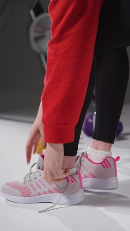 vertical shot of a girl packing gym bag