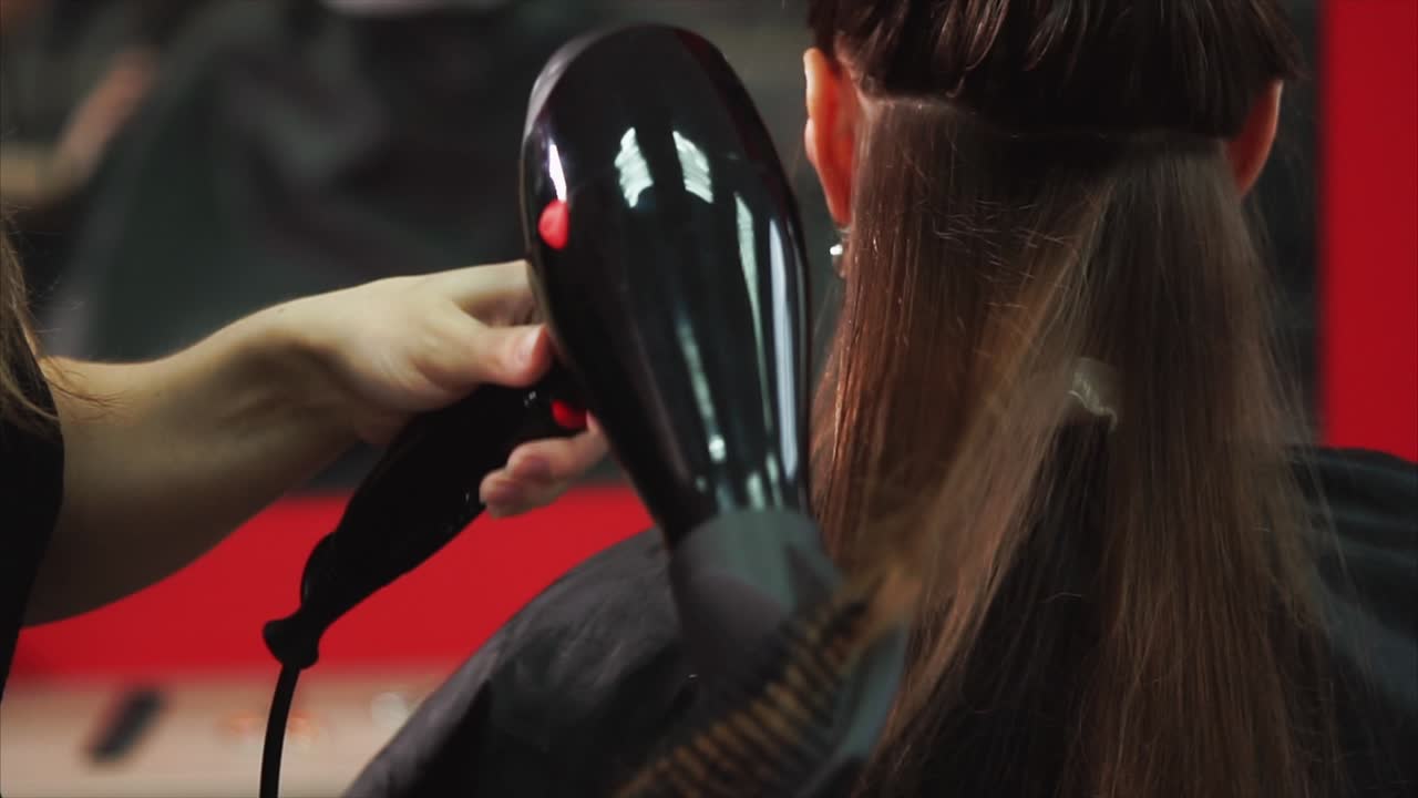Hair Salon: Styling a Woman's Hair with a Hair Dryer and Brush