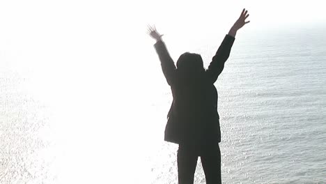 Woman-on-a-Cliff-Worshipping