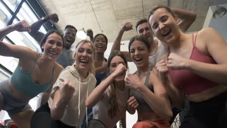 happy fitness group celebrating success
