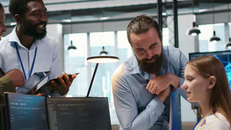 Startup Newcomer Making Friends In Office, Learning How To Use Machine Learning